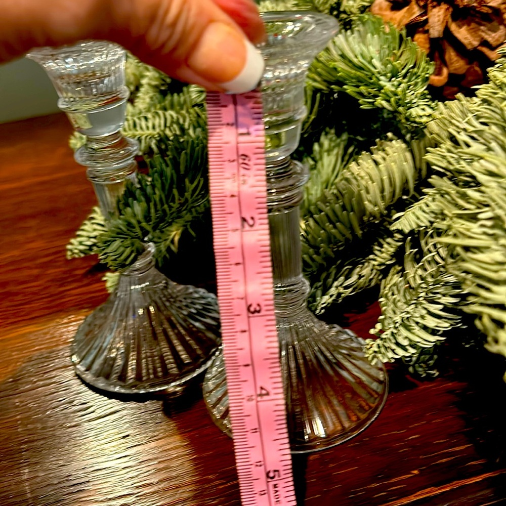 Small glasss (4candlesticks ) that are  51/2 inches in size , 1inch candle base